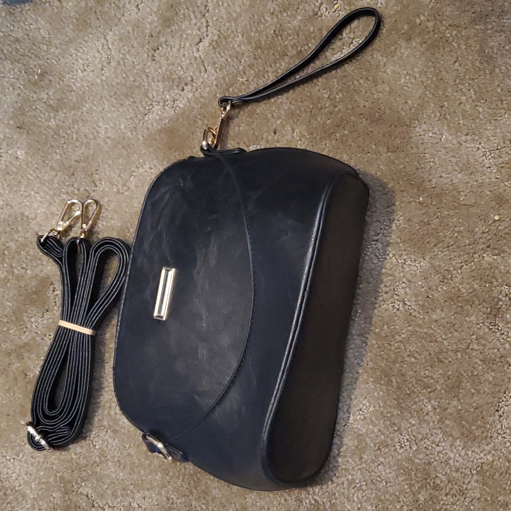 Black bag, cross body or wristlet or shoulder, adjustable.  New nwot